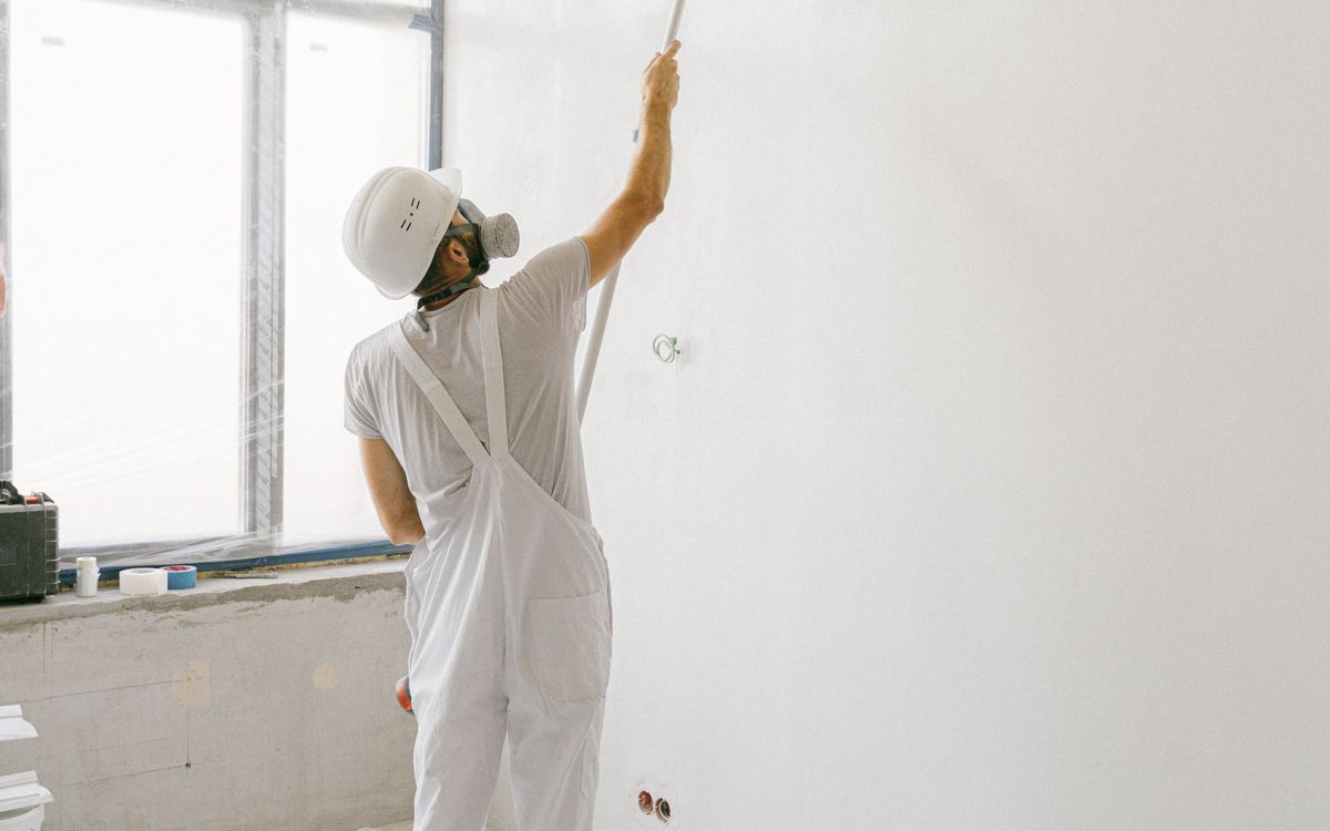 Painter applying a fresh finish to an interior wall