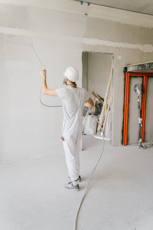 A Man Renovating a Home