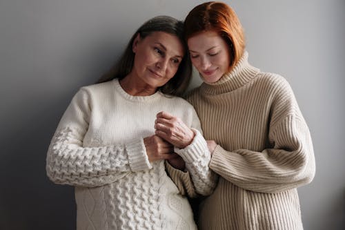 Free Women Wearing Knitted Sweaters Stock Photo