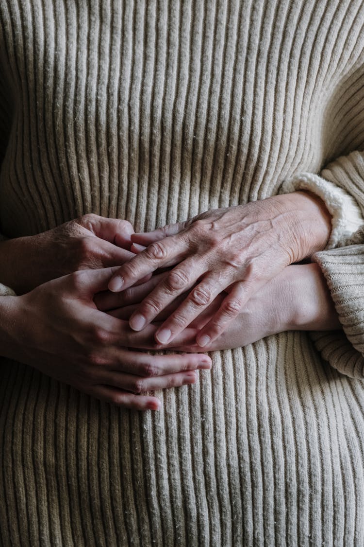 A Mother And Daughter Holding Hands