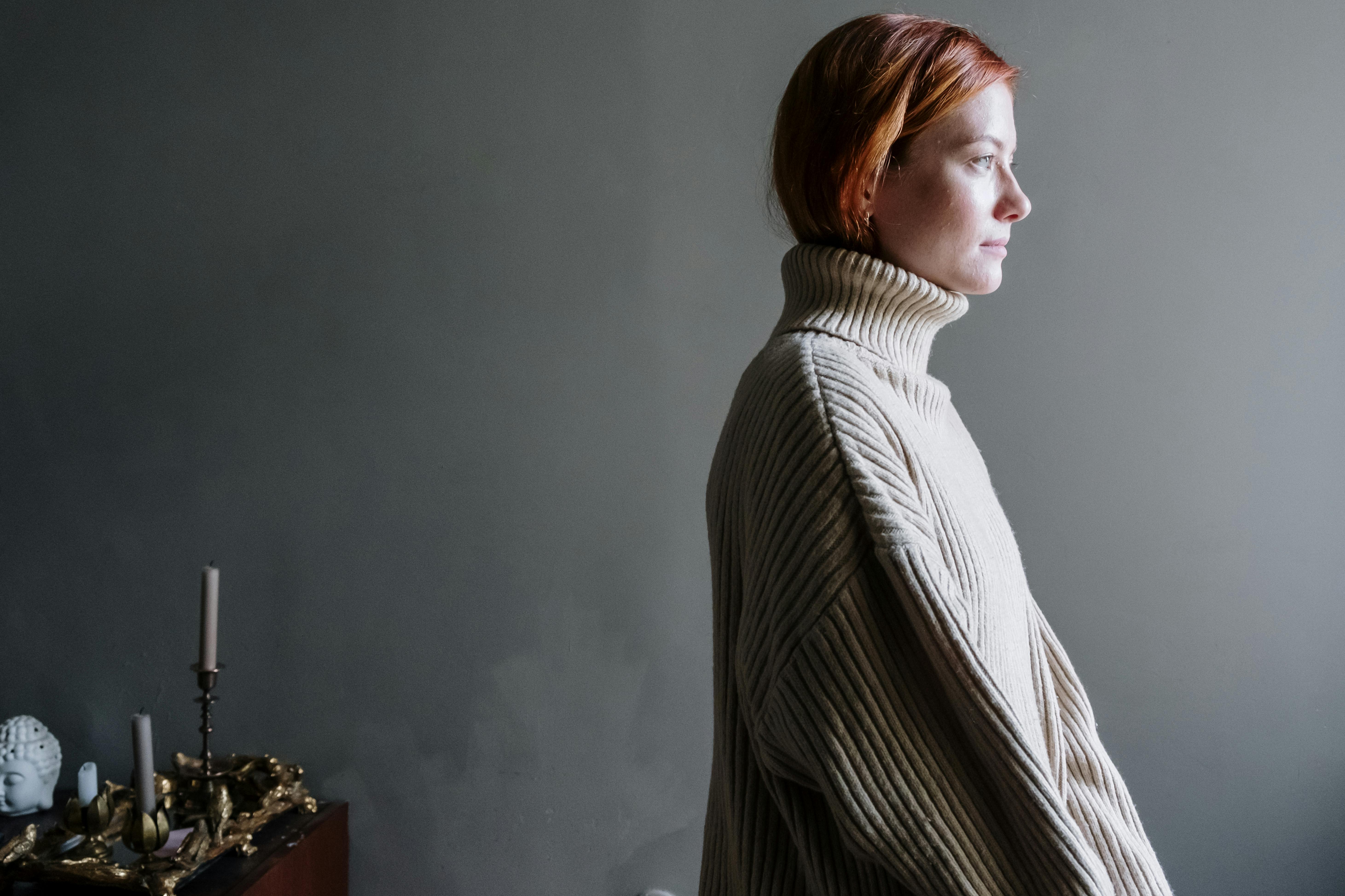 A folded cashmere jumper in soft natural light