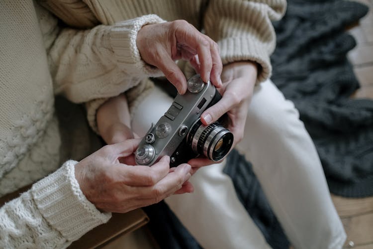 Person Holding Retro Camera 