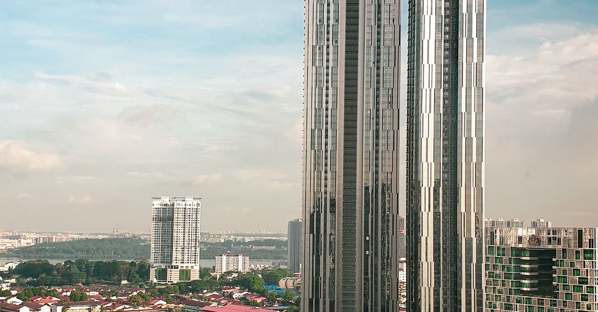 Aerial view of modern skyscrapers in Johor Bahru, Malaysia, showcasing urban architecture.