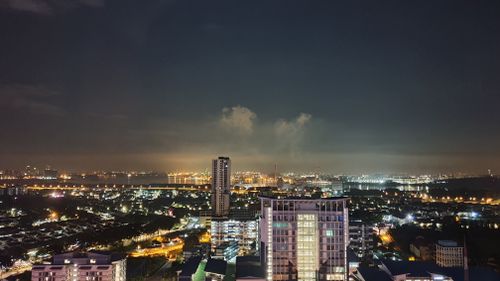 Free A vibrant night view of the Johor Bahru skyline with illuminated city lights and clear sky. Stock Photo
