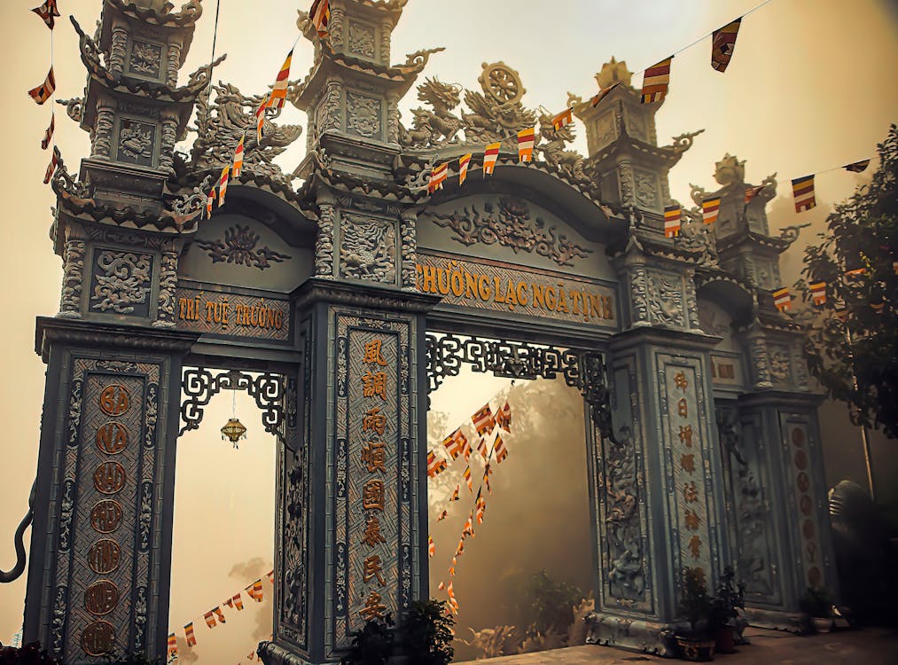 Free Ancient Gateway Filled with Cultural Sculptures  Stock Photo