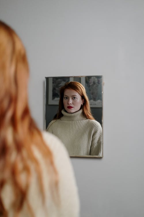 Free A Woman in Turtleneck Sweater Reflection on a MIrror Stock Photo