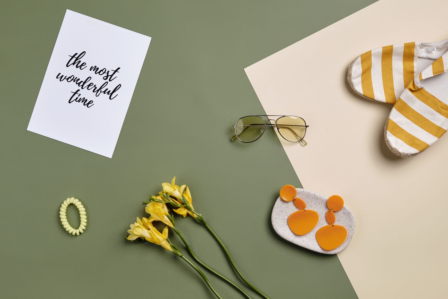 Flat lay of summer accessories including sunglasses, flowers, and a card.. flat, summer, accessories