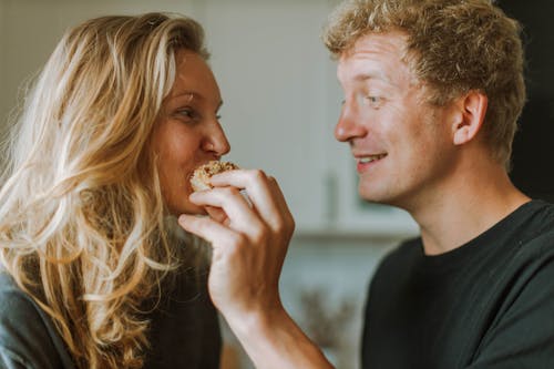 Couple Smiling while Looking at Each Other