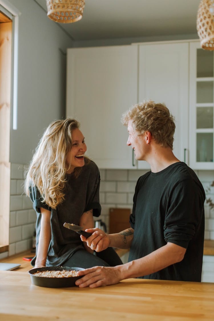 Man And Woman In The Kitchen Together