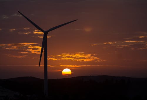 Silhouette of a Wind Turbine During the Golden Hour 