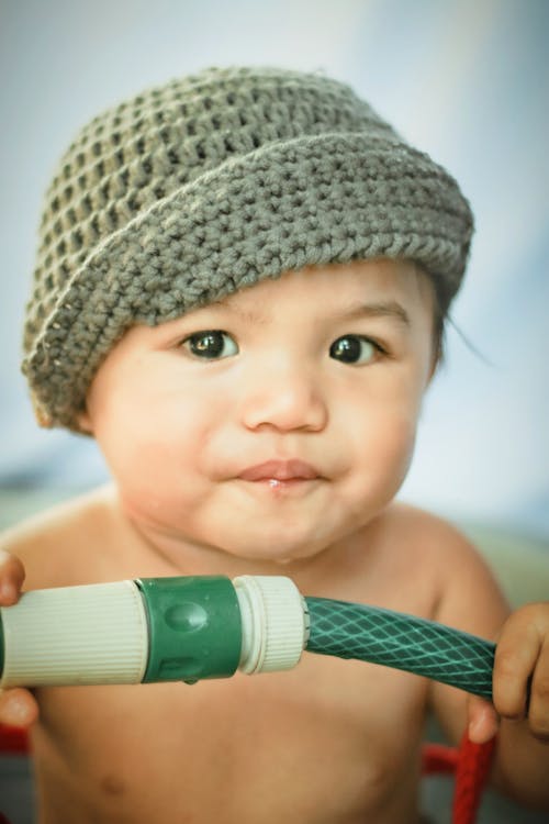Free Cute baby boy in knitted hat Stock Photo