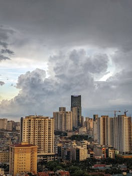 Capture of Hanoi's skyline with dramatic clouds, showcasing modern architecture.