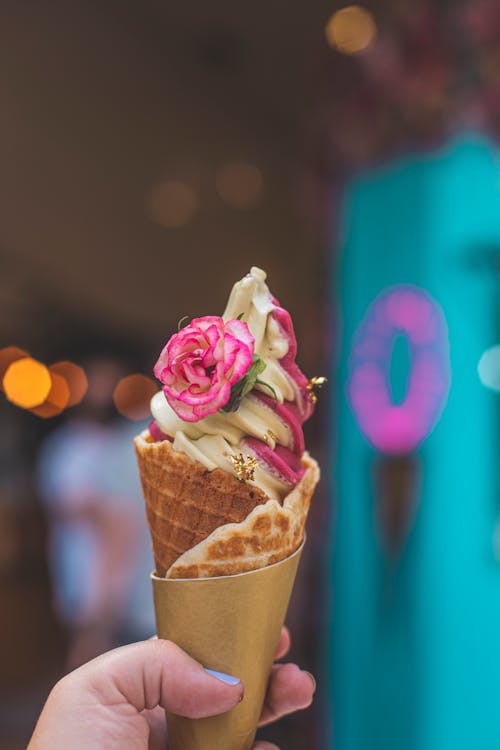 Pink and White Ice Cream on Brown Cone