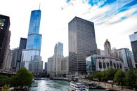 High Rise Buildings Near Body of Water Under Blue Sky
