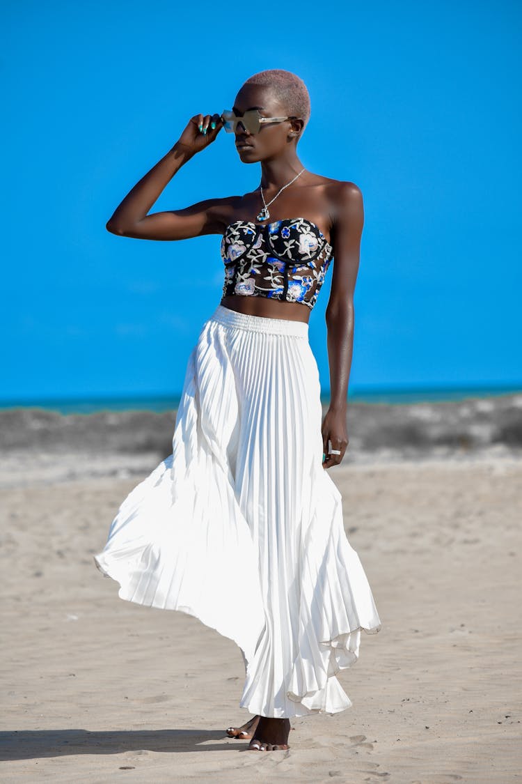 Woman In Fashion Clothes Posing On Beach