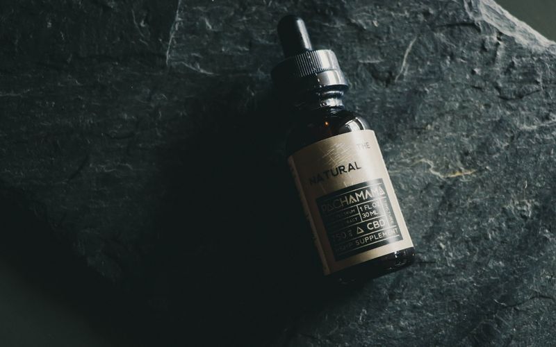 Bottles of CBD oil and hemp wellness products arranged for online purchase in Canada