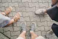 Person in Brown Shorts and White Sneakers