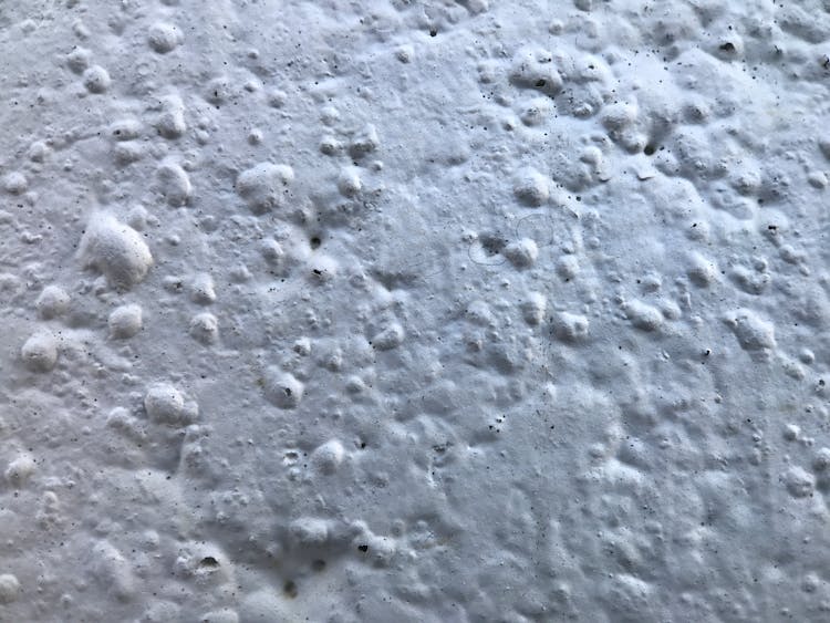 Close Up Of A Porous Texture Of A White Wall