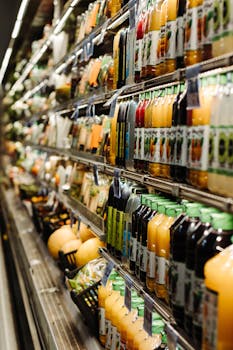 Vibrant array of bottled beverages on display in a Brazilian supermarket aisle.