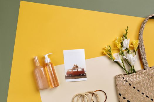 Flat lay of travel essentials with yellow flowers and a woven bag on colorful paper background.. pexels, flat, travel