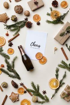 Celebrate the New Year with a festive flat lay featuring champagne, spices, and decorations in a winter setting.. pexels, cel