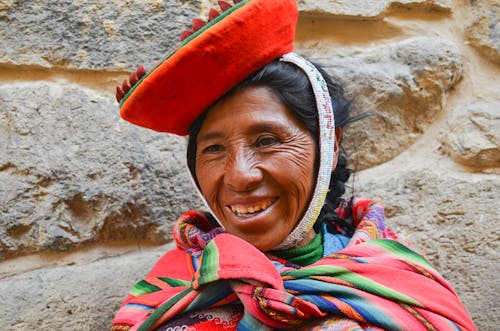 Portrait of Smiling Woman in Colorful Traditional Outfit