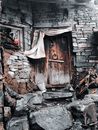 Brown Wooden Door on Gray Concrete Brick Wall