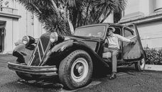 Man Getting Out of Vintage Car