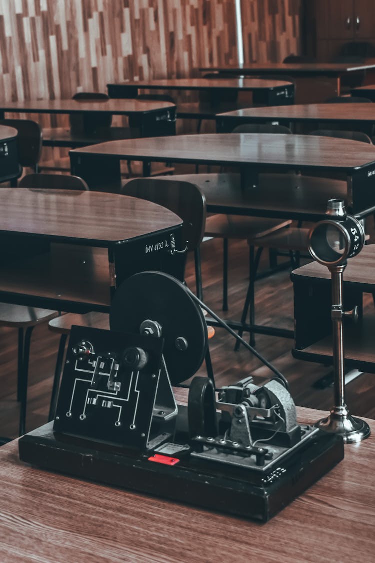 Vintage Dynamo Electric Machine Placed On Table In Classroom