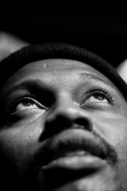 Black man in hat in daytime