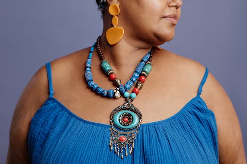 A Woman Wearing Beaded Necklace