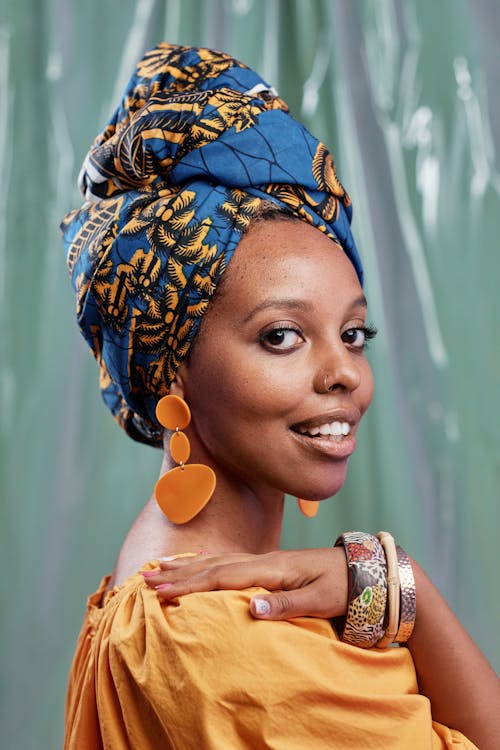 A Woman Wearing Turban Posing at the Camera