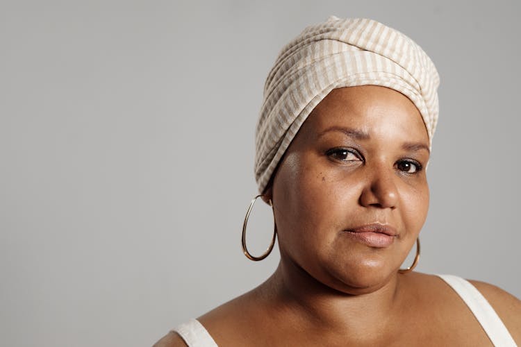 Portrait Of A Woman Wearing Headwrap