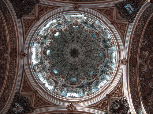 Free A stunning view of the intricate dome ceiling inside the Granada Cathedral. Stock Photo