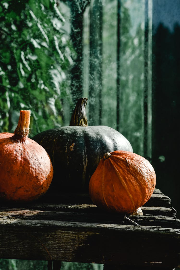 Photograph Of Squashes On A Wooden Surface