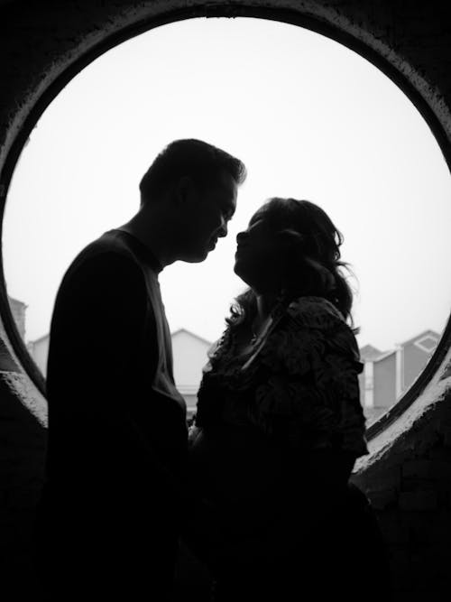 Free Monochrome Photograph of a Couple Face to Face Stock Photo