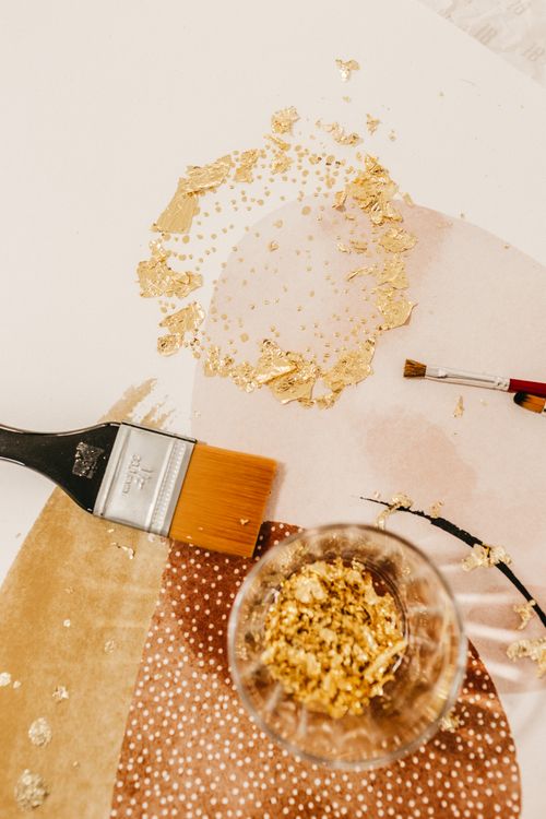 Art tools on surface with abstract image · Free Stock Photo