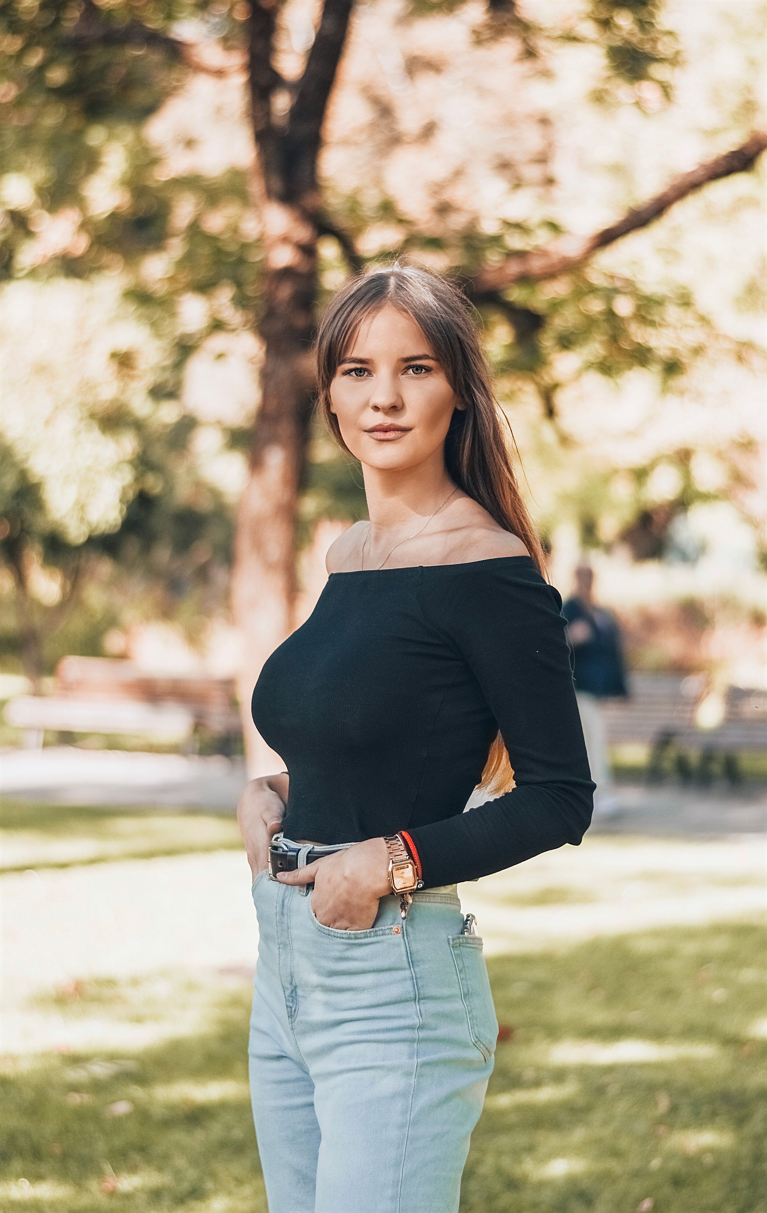 Off-shoulder black top with barrel jeans