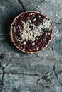 Red and White Round Cake on Gray Concrete Surface