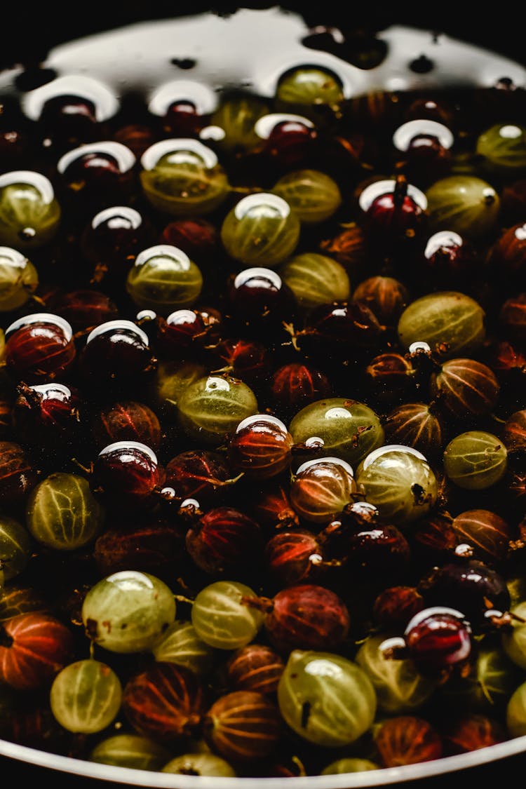 Gooseberries In Bowl With Water