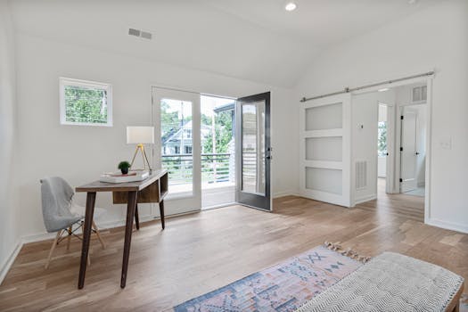 Spacious, light-filled room with a modern design, desk, and balcony access.