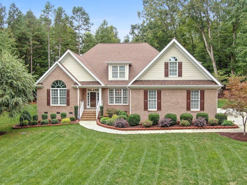 Brick House with Grass Lawn 