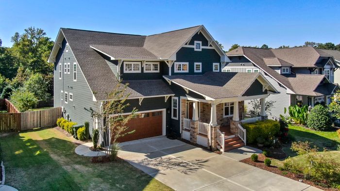 Craftsman-style house with a covered front porch. Photo by Curtis Adams on Pexels