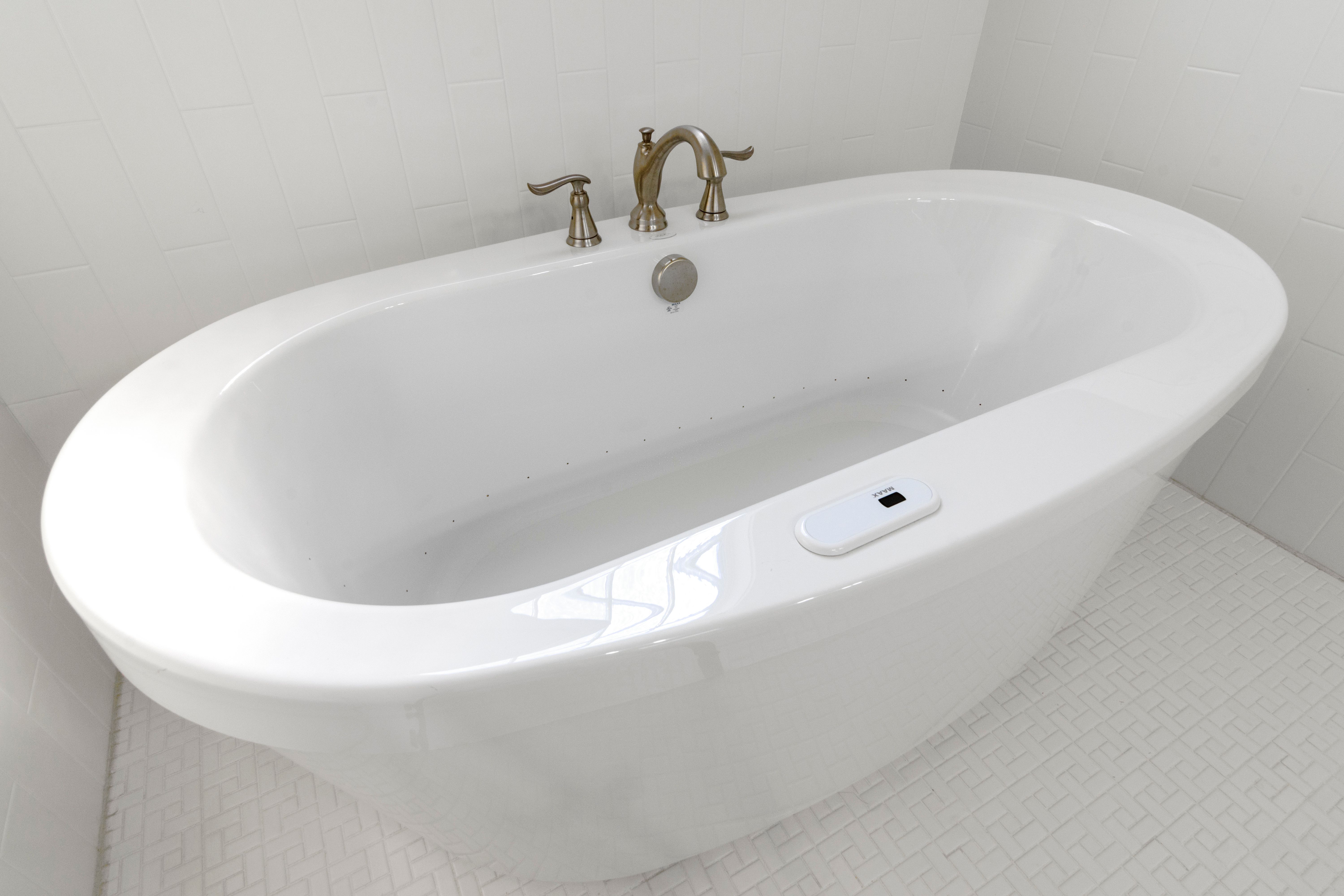 Modern luxury bathroom in Nashville featuring smart technology with sleek fixtures and ambient lighting by Curtis Adams