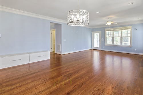 Empty Room with Blue Walls and Silver Chandelier