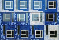 Geometrical View of Wall with Windows and Blue Tiles