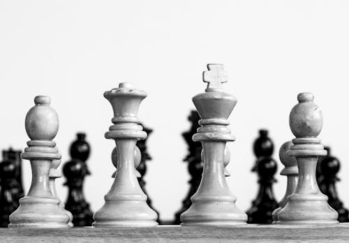 Free A Grayscale Photo of Chess Pieces Stock Photo