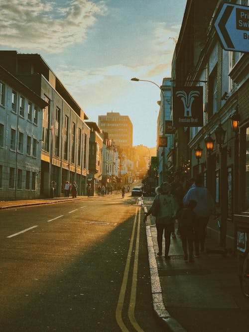 People Walking on the Sidewalk