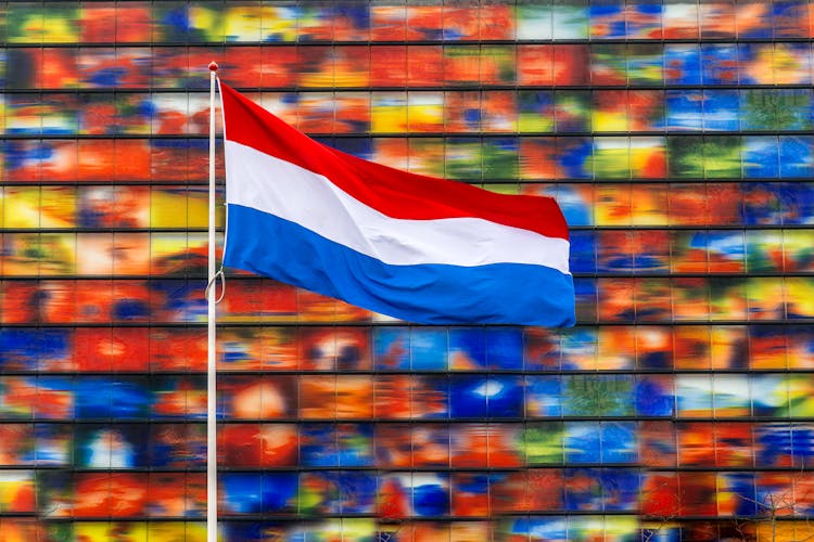 Flag Of The Netherlands On Colorful Background