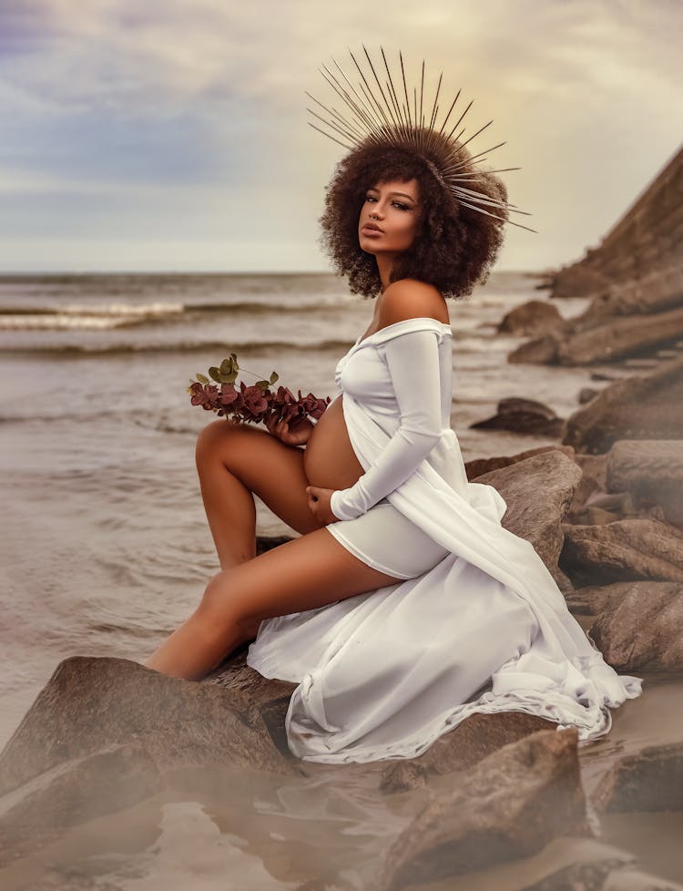 Innocent Pregnant Woman Resting On Seashore